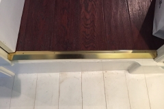 Fitting of brass door threshold